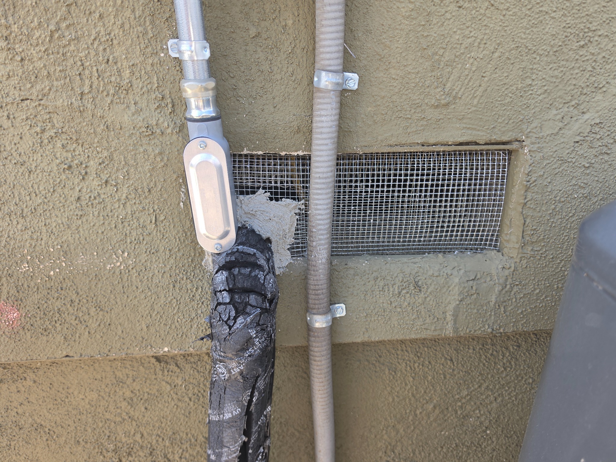 Metal mesh installed around a utility vent